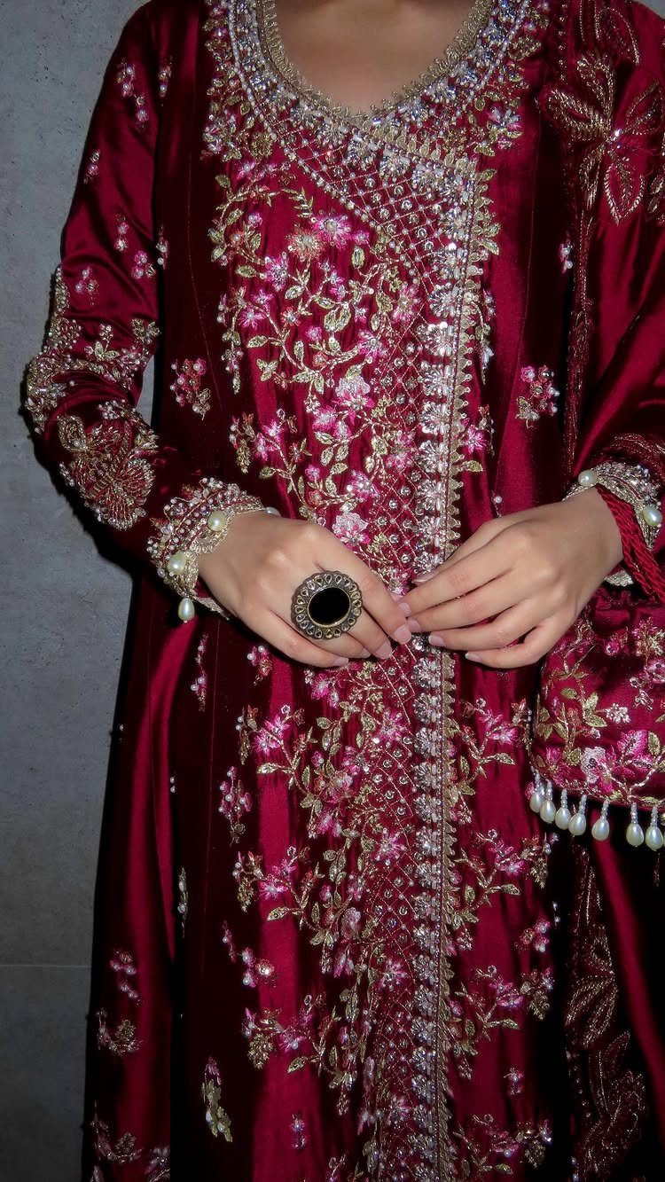 Maroon velvet Anarkali dress with heavy gold and silver floral embroidery and sequins.