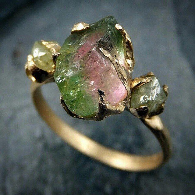 Gold ring with raw green and pink gemstones set in organic prongs