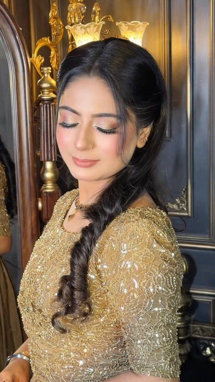 Woman with golden soft glam makeup wearing a gold sequined bridal dress