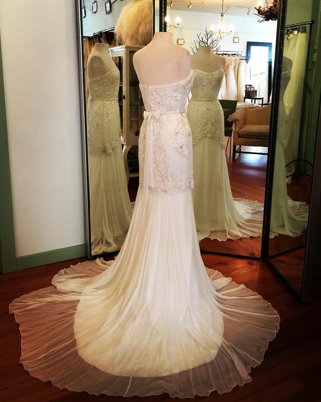 White strapless mermaid wedding dress on a mannequin in a bridal boutique
