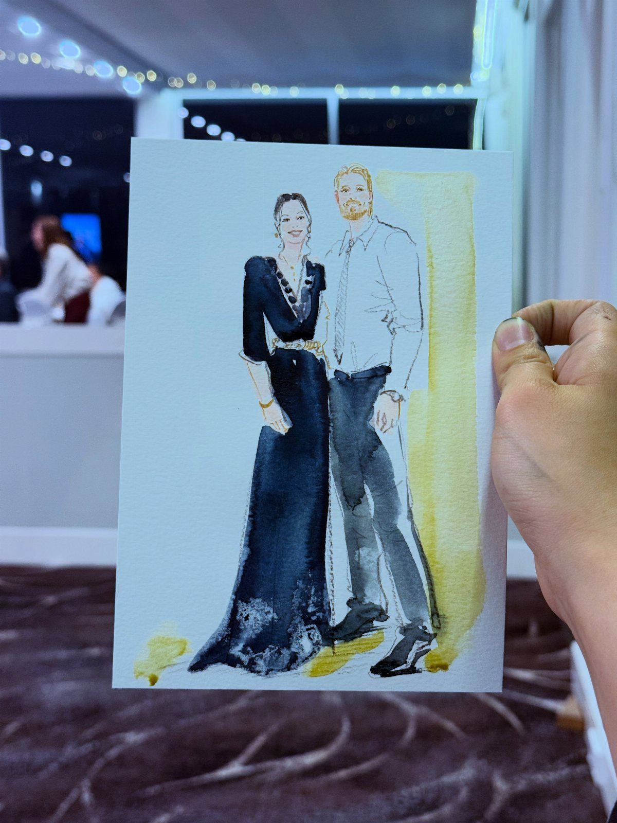 Watercolor illustration of a couple held up in a blurred indoor setting